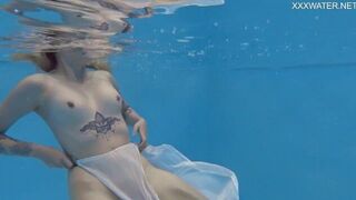 Finnish babe swims nude in the pool - porn video
